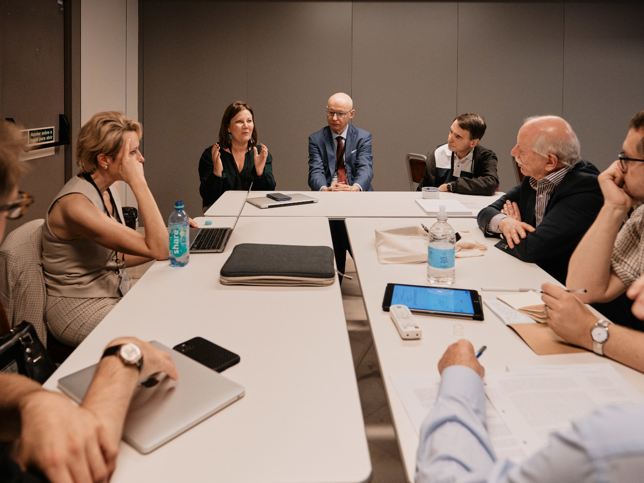 ILA Committee meeting 2022 group of people meeting and sitting around a table discussing